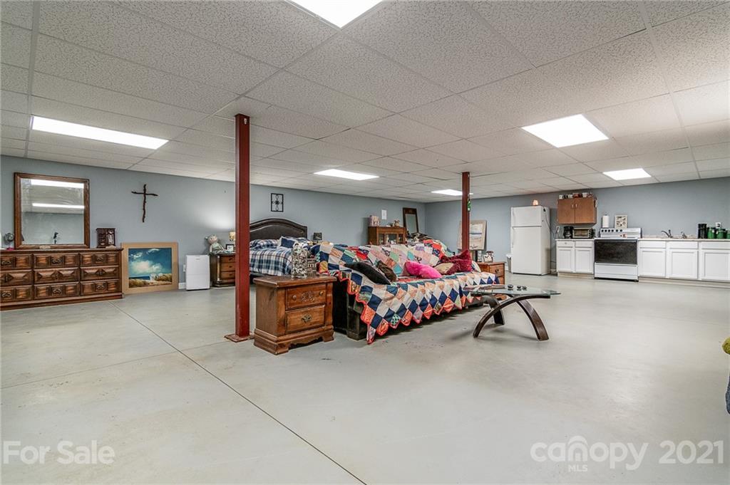 740 Renshaw Ford Road, Unit 5 Woodleaf, NC 27054 - Photo 26 of 30 a bedroom with furniture and a bed