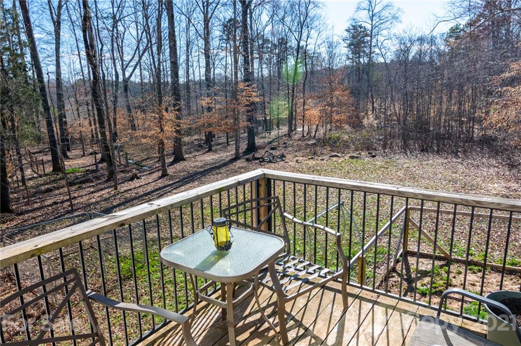 740 Renshaw Ford Road, Unit 5 Woodleaf, NC 27054 - Photo 29 of 30 a view of balcony with furniture and wooden deck