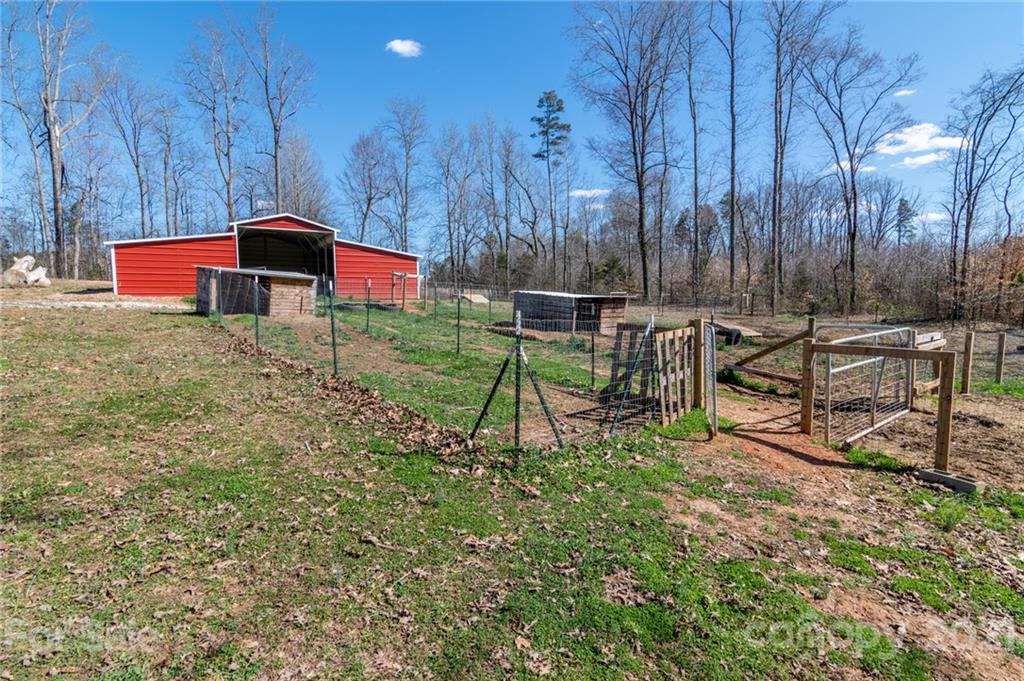 740 Renshaw Ford Road, Unit 5 Woodleaf, NC 27054 - Photo 4 of 30 a garden view with a seating space