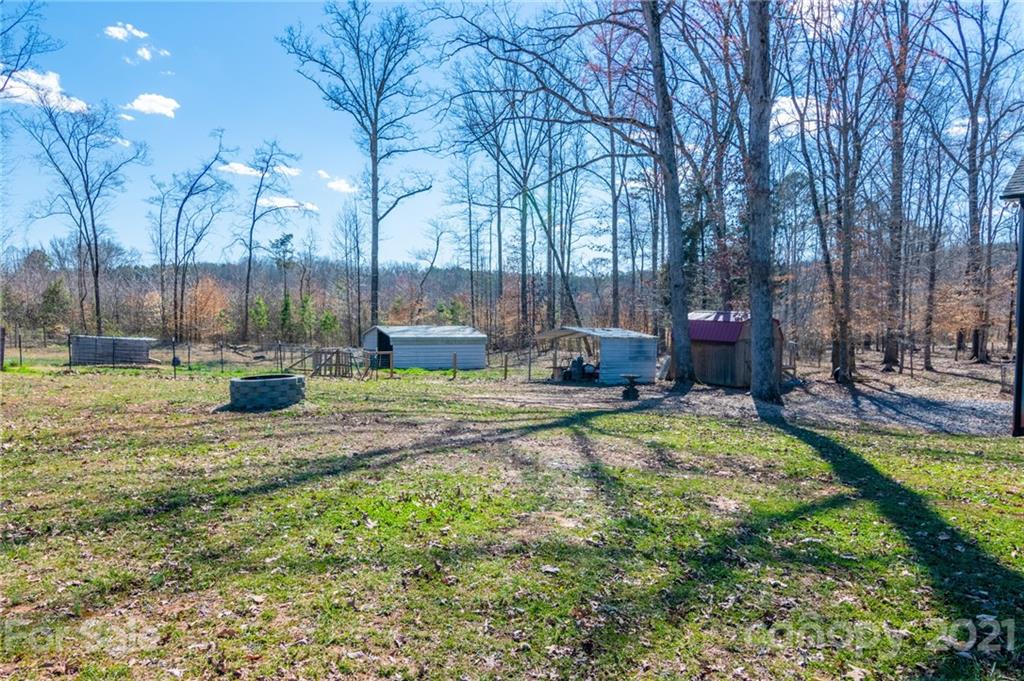 740 Renshaw Ford Road, Unit 5 Woodleaf, NC 27054 - Photo 6 of 30 a view of a garden with a slide