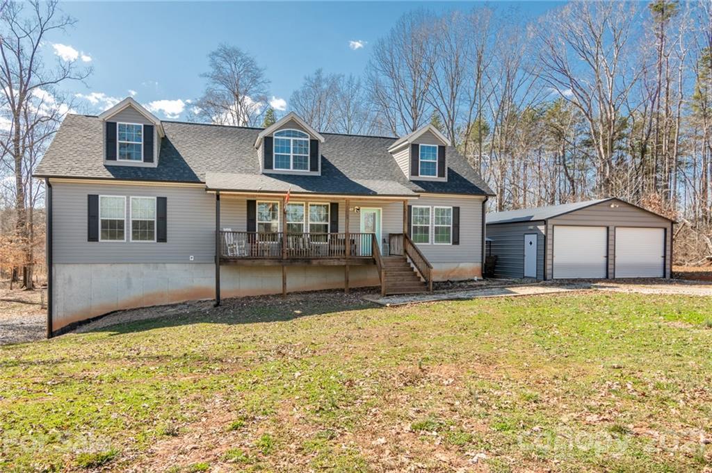 740 Renshaw Ford Road, Unit 5 Woodleaf, NC 27054 - Photo 8 of 30 a view of a house with a swimming pool and a yard