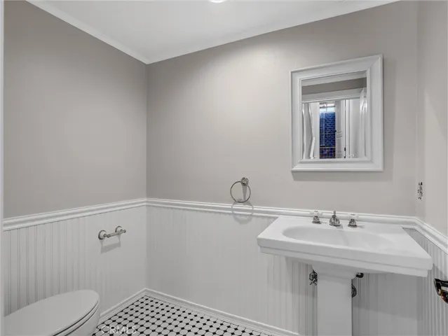 a bathroom with a sink toilet and vanity
