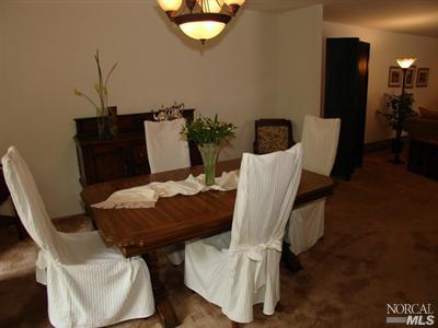 1696 Happy Valley Road Santa Rosa, CA 95404 - Photo 5 of 9 a view of a dining room with furniture and wooden floor