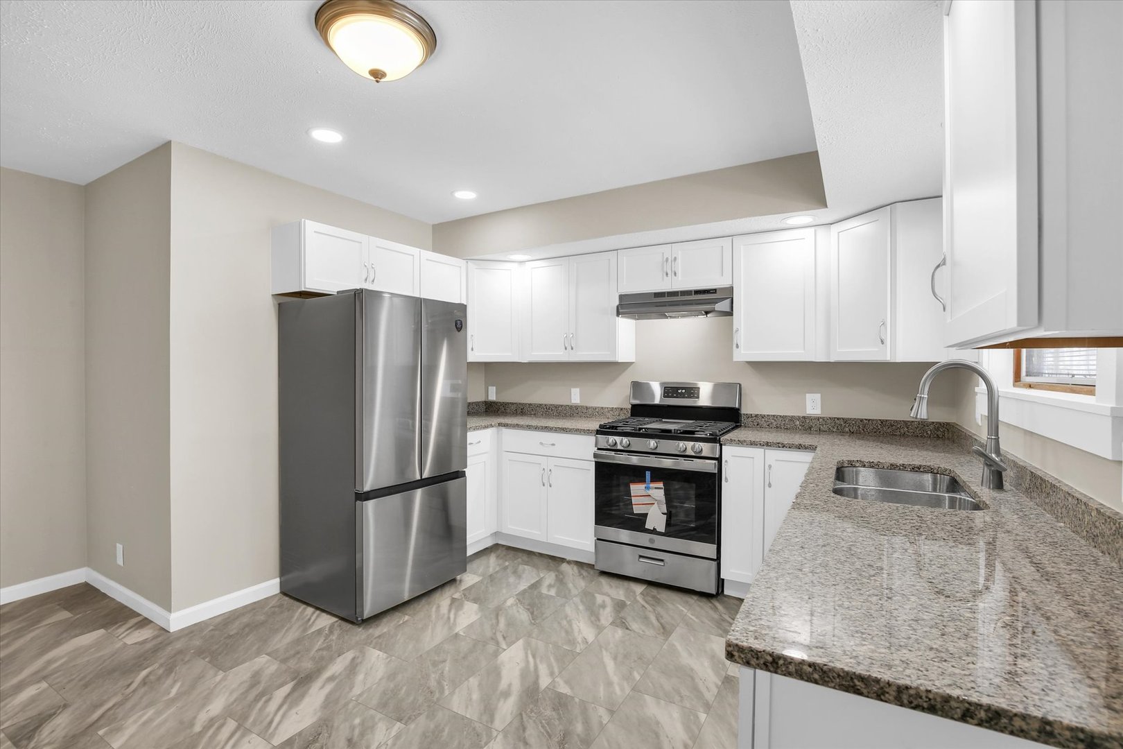 305 East Main Street Ogden, IL 61859 - Photo 12 of 31 a kitchen with a refrigerator stove and sink