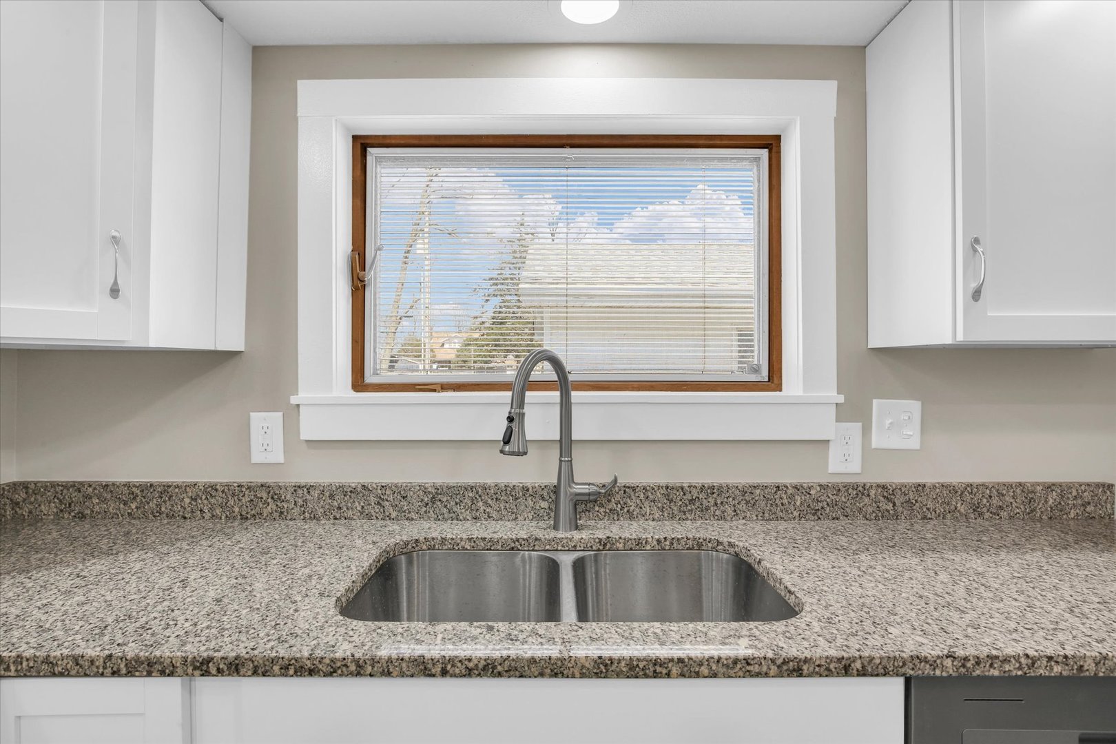305 East Main Street Ogden, IL 61859 - Photo 14 of 31 a kitchen with granite countertop a sink and a counter top space