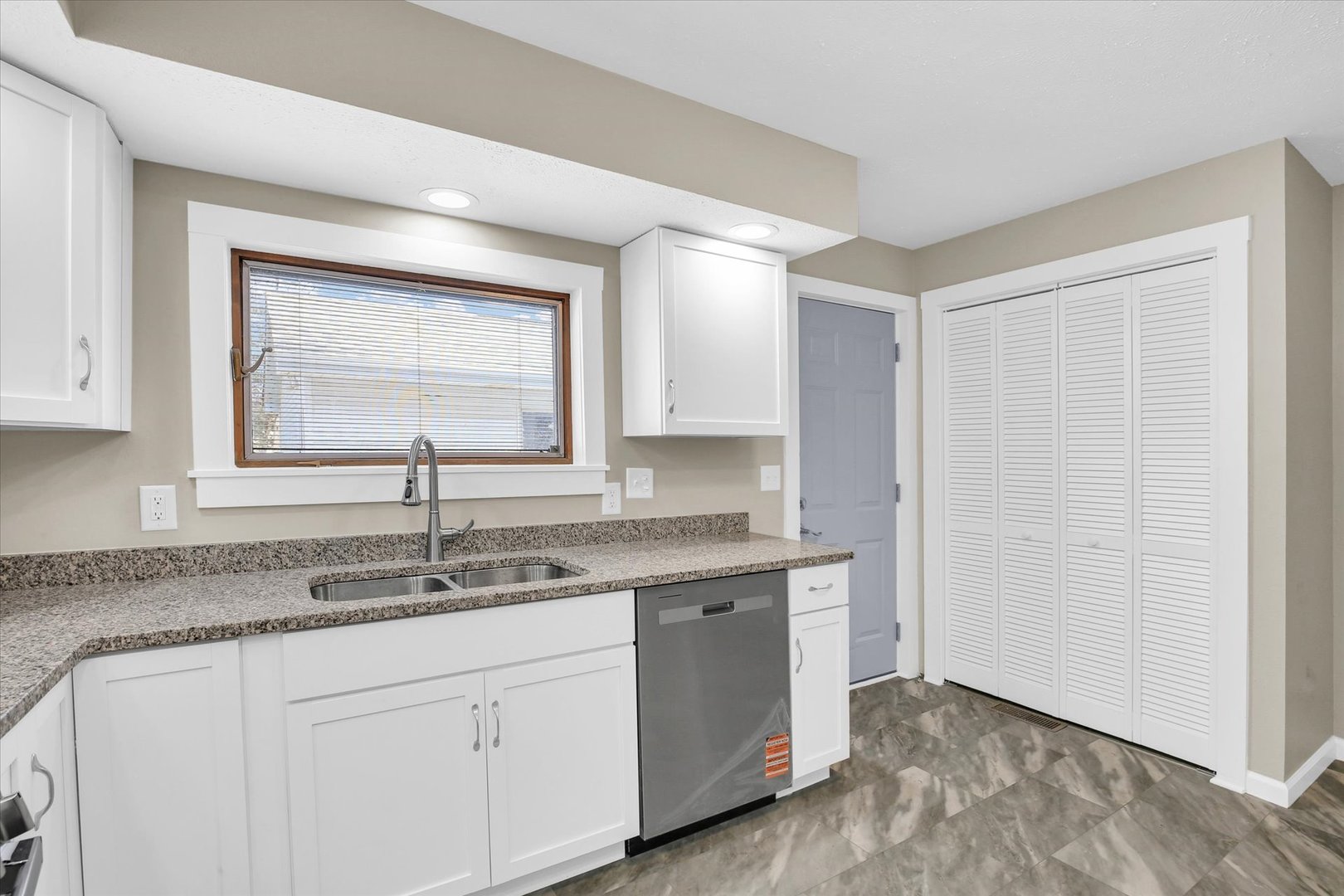 305 East Main Street Ogden, IL 61859 - Photo 15 of 31 a bathroom with a granite countertop sink and a mirror