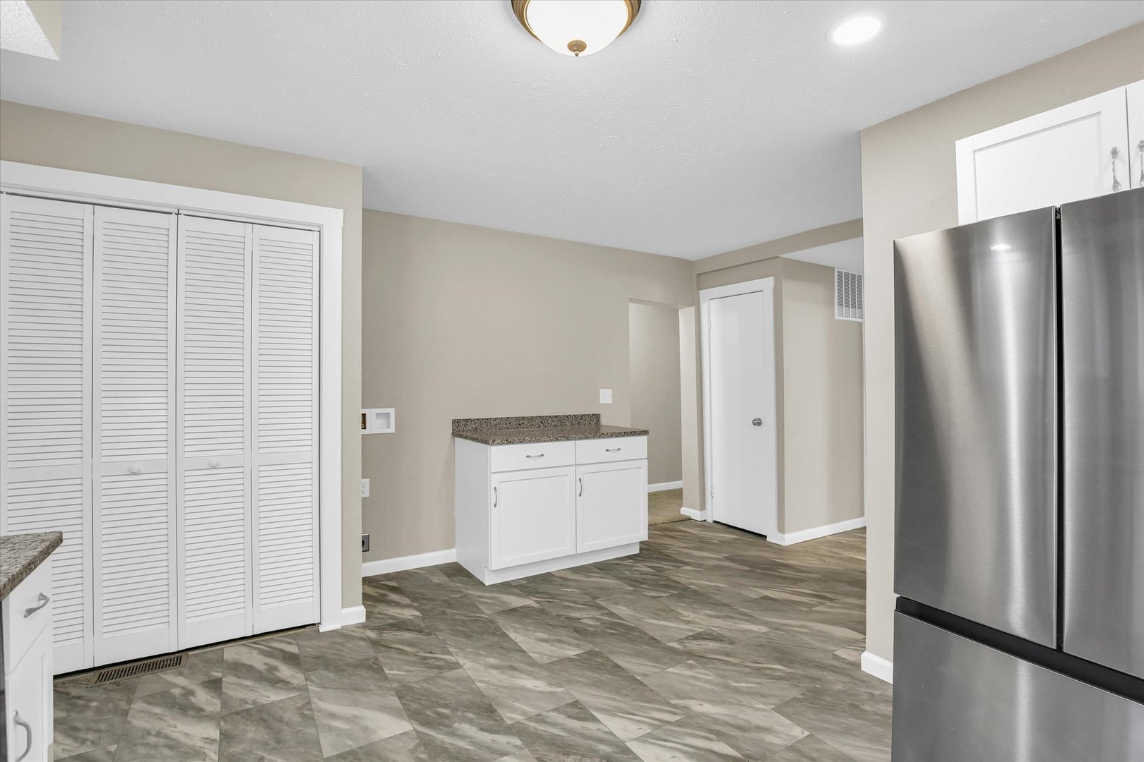 305 East Main Street Ogden, IL 61859 - Photo 16 of 31 a room with a bed and a refrigerator
