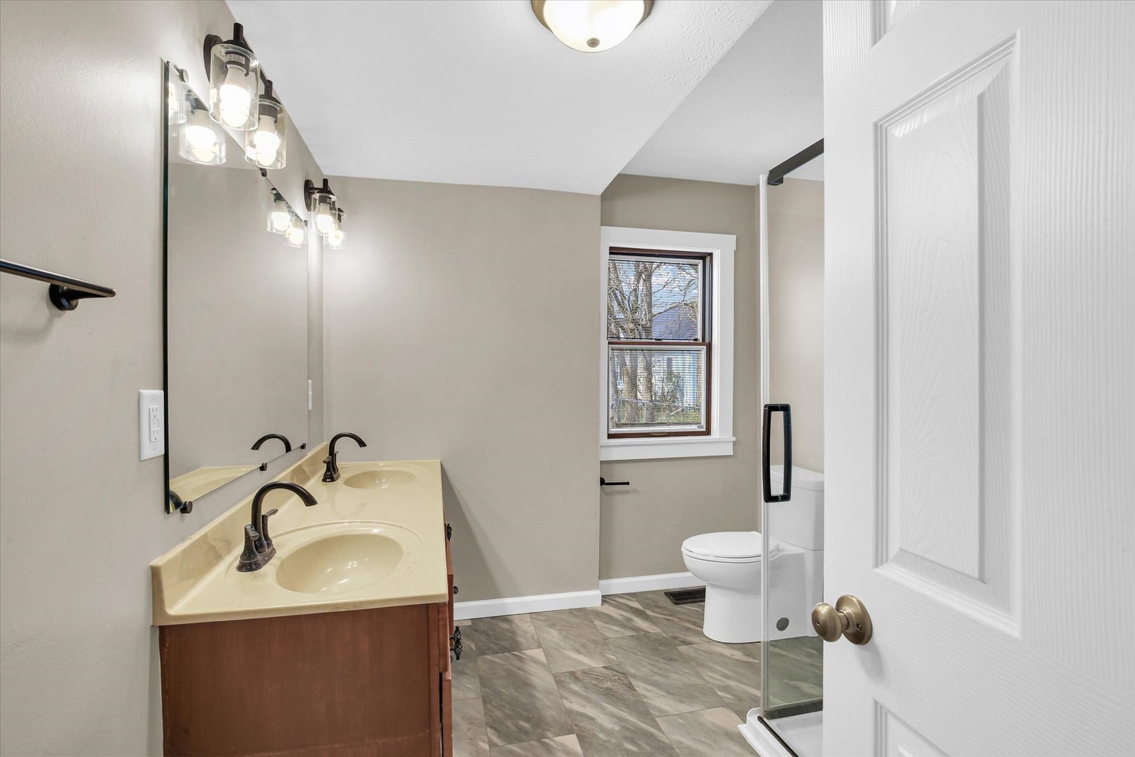 305 East Main Street Ogden, IL 61859 - Photo 18 of 31 a bathroom with a sink toilet and shower