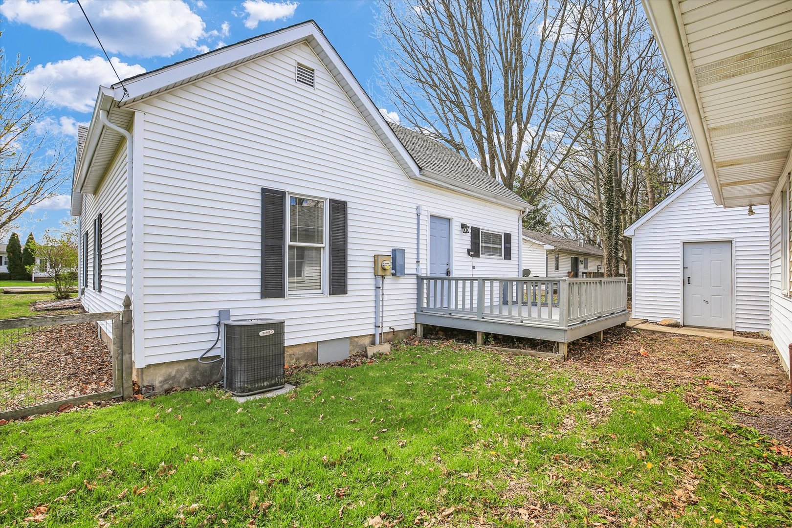305 East Main Street Ogden, IL 61859 - Photo 22 of 31 a view of a house with a yard and deck