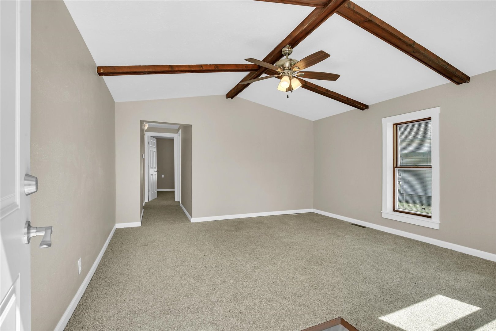 305 East Main Street Ogden, IL 61859 - Photo 4 of 31 an empty room with windows and fan