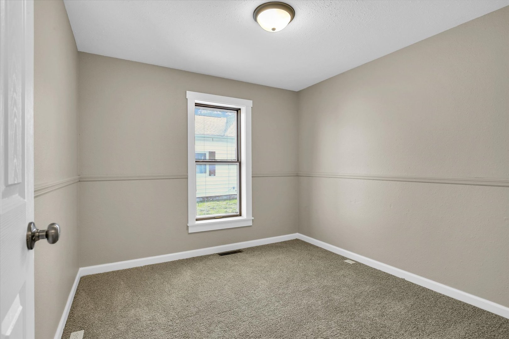 305 East Main Street Ogden, IL 61859 - Photo 7 of 31 an empty room with windows
