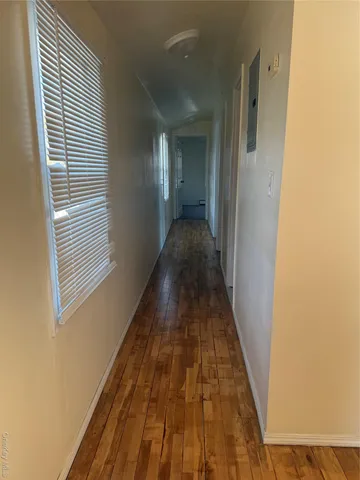 a kitchen with granite countertop a refrigerator sink and cabinets