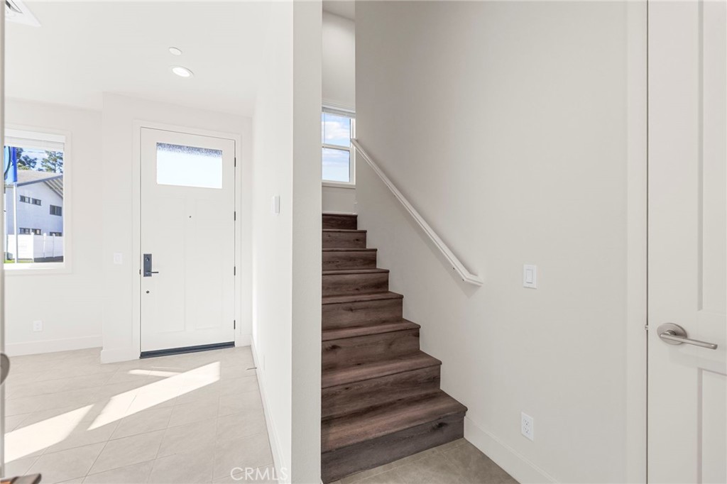 19011 Main Street, Unit 101 Huntington Beach, CA 92648 - Photo 12 of 36 a view of entryway with wooden floor