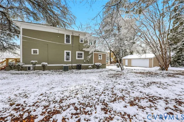 a backyard of a house with cars parked