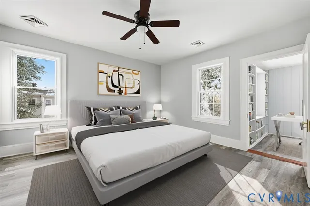 a bedroom with a large bed and a window