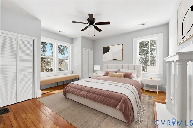 a bedroom with a bed and wooden floor