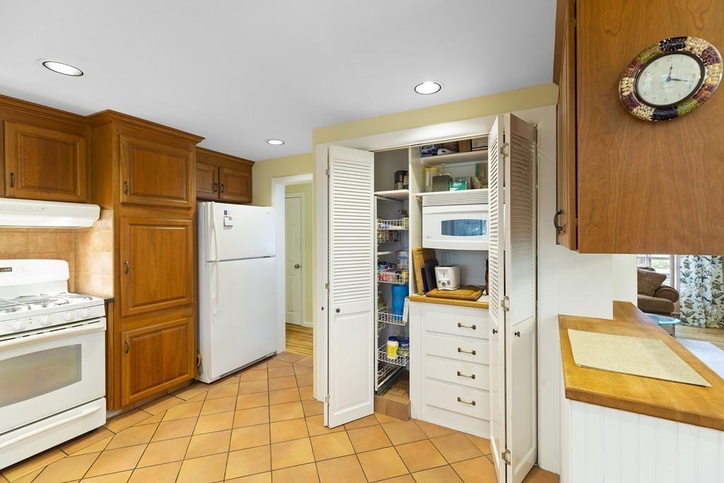 54 Joyce Road Framingham, MA 01701 - Photo 14 of 42 a kitchen with a refrigerator and a stove