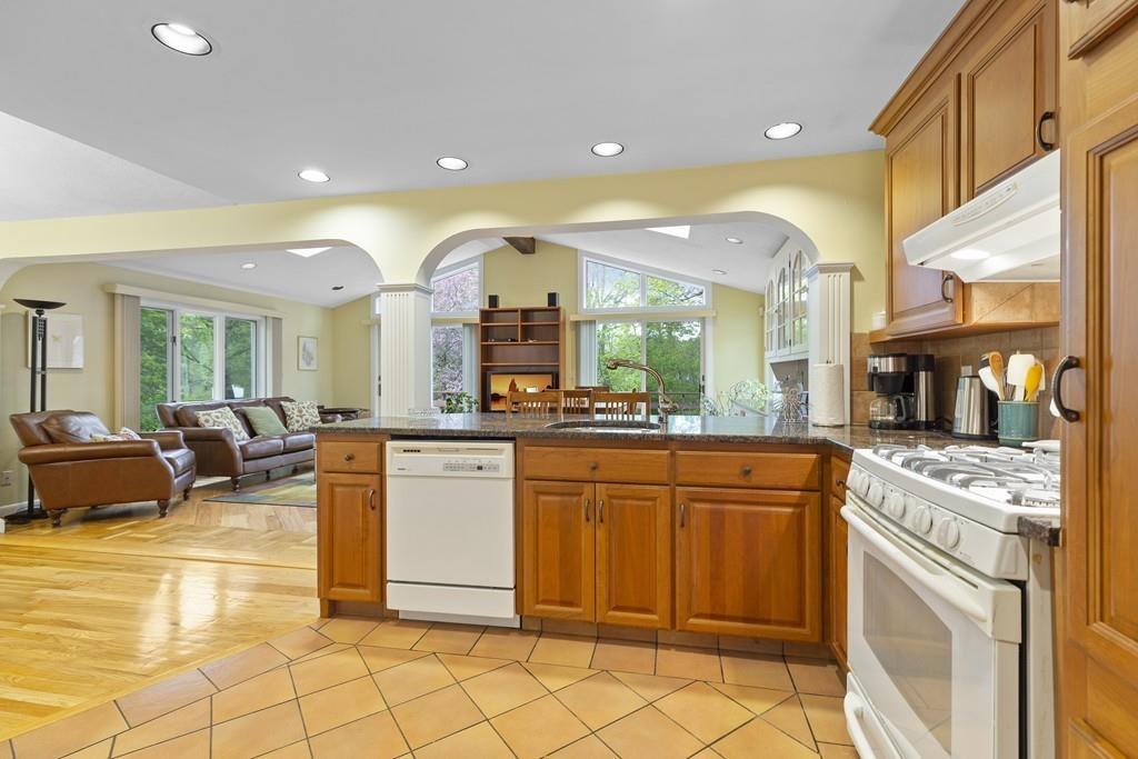 54 Joyce Road Framingham, MA 01701 - Photo 15 of 42 a kitchen with stainless steel appliances granite countertop a sink and cabinets