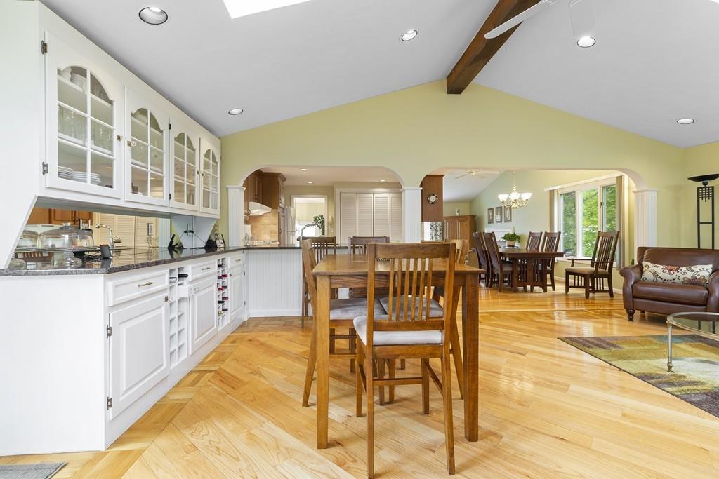 54 Joyce Road Framingham, MA 01701 - Photo 20 of 42 a dining hall with stainless steel appliances kitchen island granite countertop a table and chairs