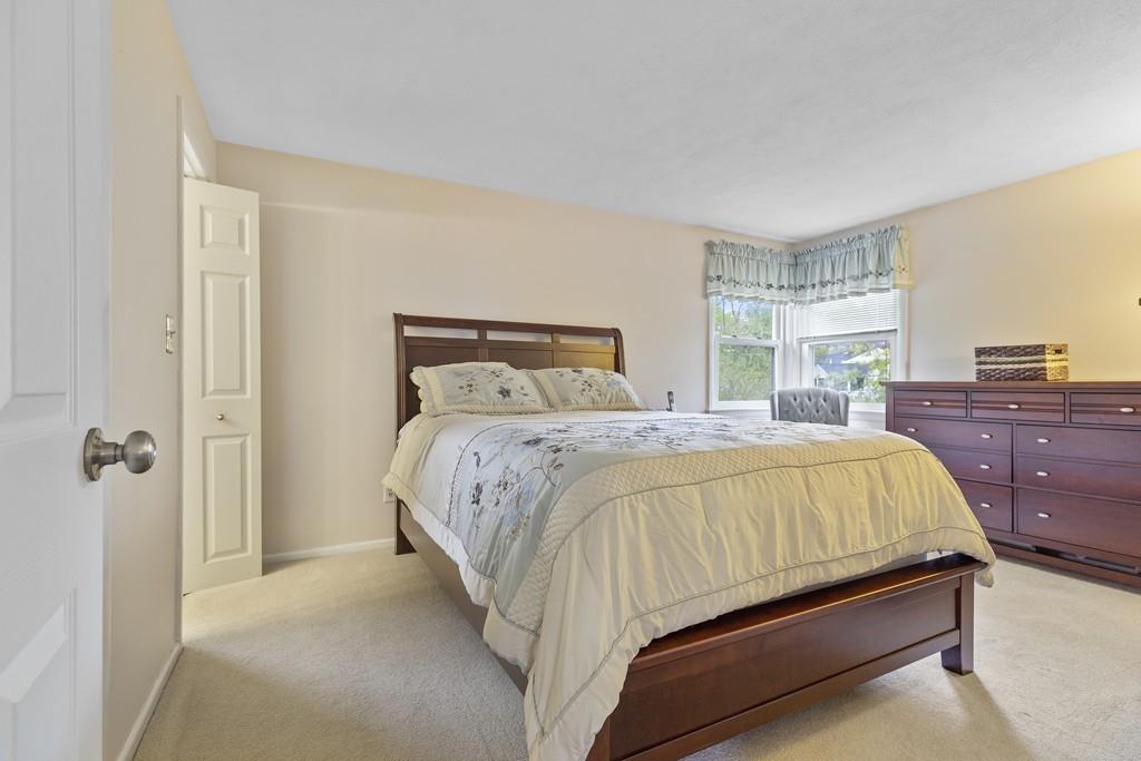54 Joyce Road Framingham, MA 01701 - Photo 21 of 42 a bedroom with a bed and a dresser