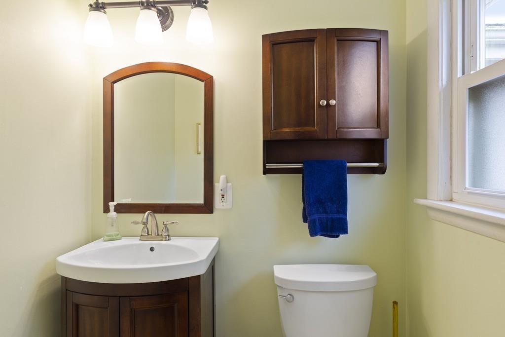54 Joyce Road Framingham, MA 01701 - Photo 23 of 42 a bathroom with a toilet sink and mirror