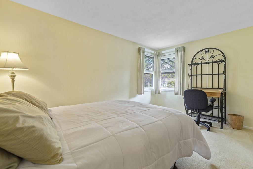 54 Joyce Road Framingham, MA 01701 - Photo 24 of 42 a bedroom with a bed a desk and chair with window