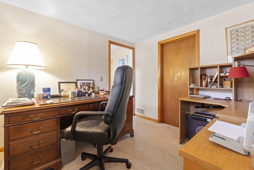 54 Joyce Road Framingham, MA 01701 - Photo 31 of 42 a view of a workspace with furniture and a lamp