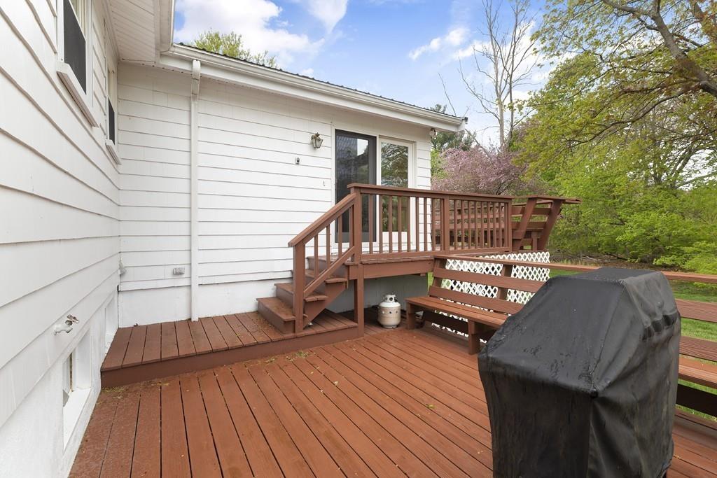 54 Joyce Road Framingham, MA 01701 - Photo 33 of 42 a view of a roof deck with wooden floor and fence