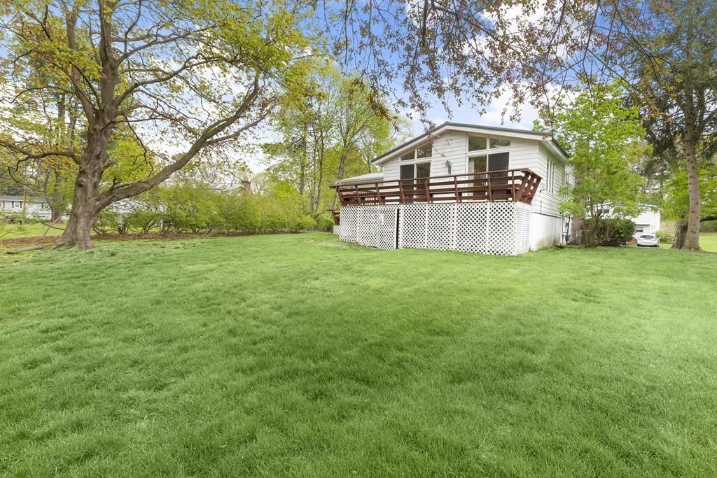 54 Joyce Road Framingham, MA 01701 - Photo 36 of 42 a view of a house with a big yard and large trees