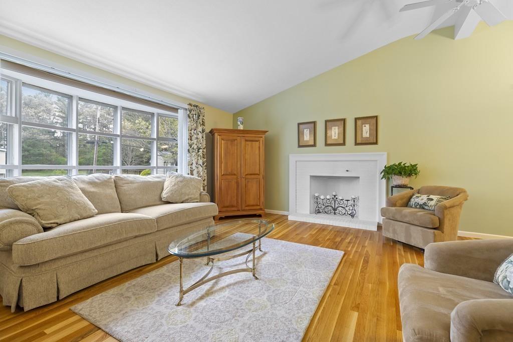 54 Joyce Road Framingham, MA 01701 - Photo 7 of 42 a living room with furniture and a fireplace