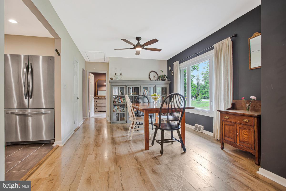 976 Shore Acres Road Arnold, MD 21012 - Photo 18 of 40 a view of a dining room with furniture window and wooden floor