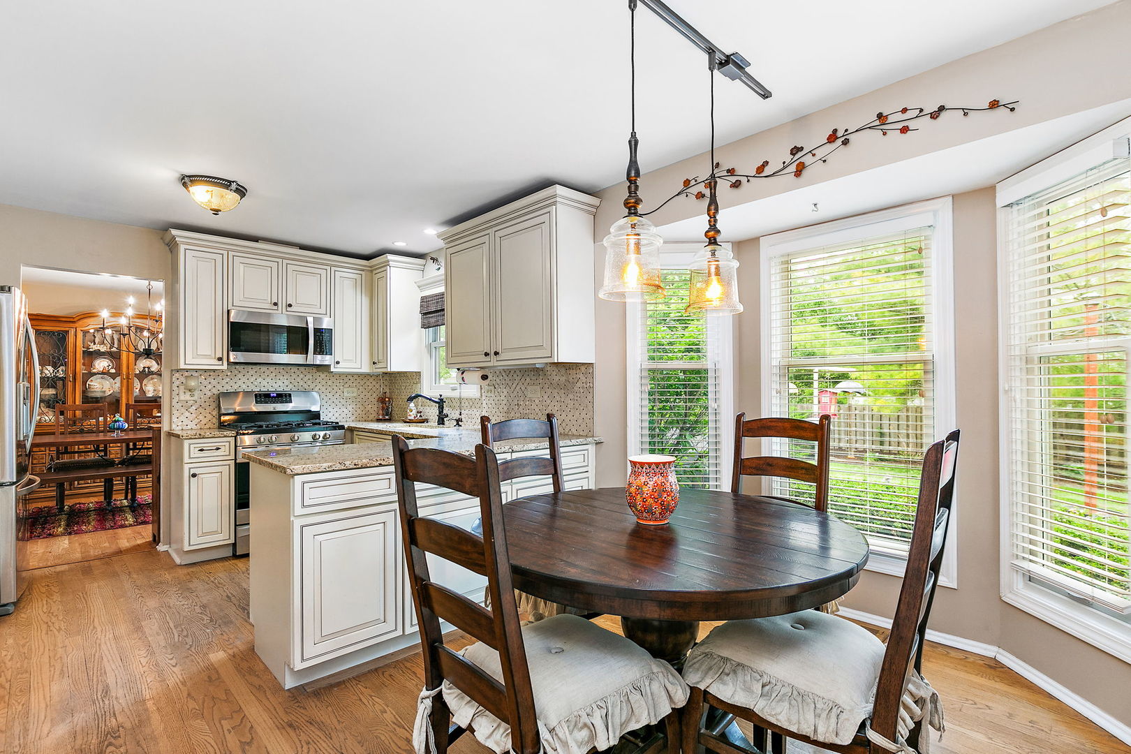 112 Thompson Boulevard Buffalo Grove, IL 60089 - Photo 11 of 34 a view of a dining room with furniture window and outside view