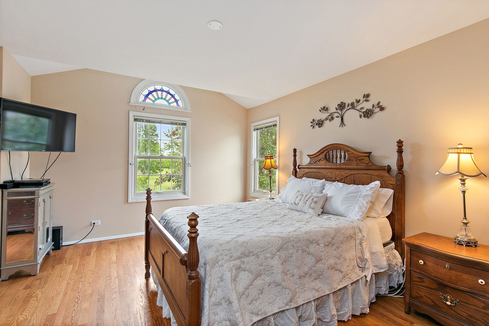 112 Thompson Boulevard Buffalo Grove, IL 60089 - Photo 16 of 34 a bedroom with a bed and a flat screen tv