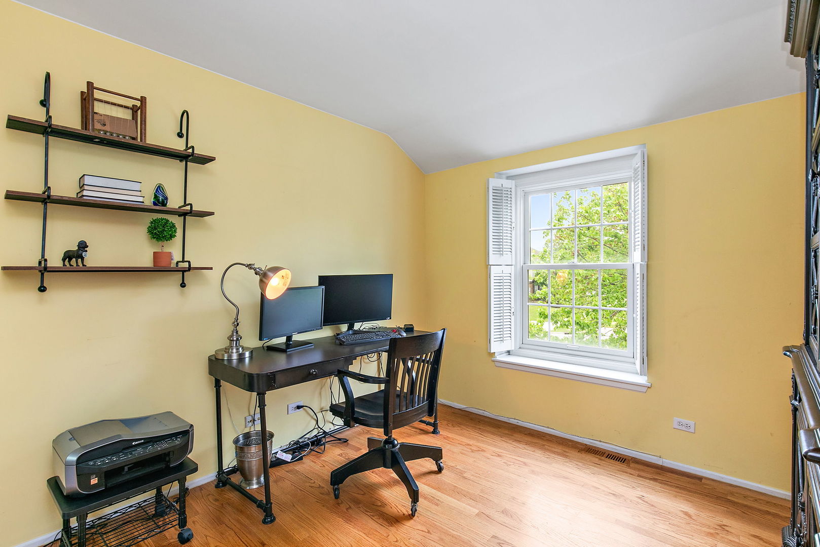 112 Thompson Boulevard Buffalo Grove, IL 60089 - Photo 22 of 34 a view of a workspace with furniture and a window