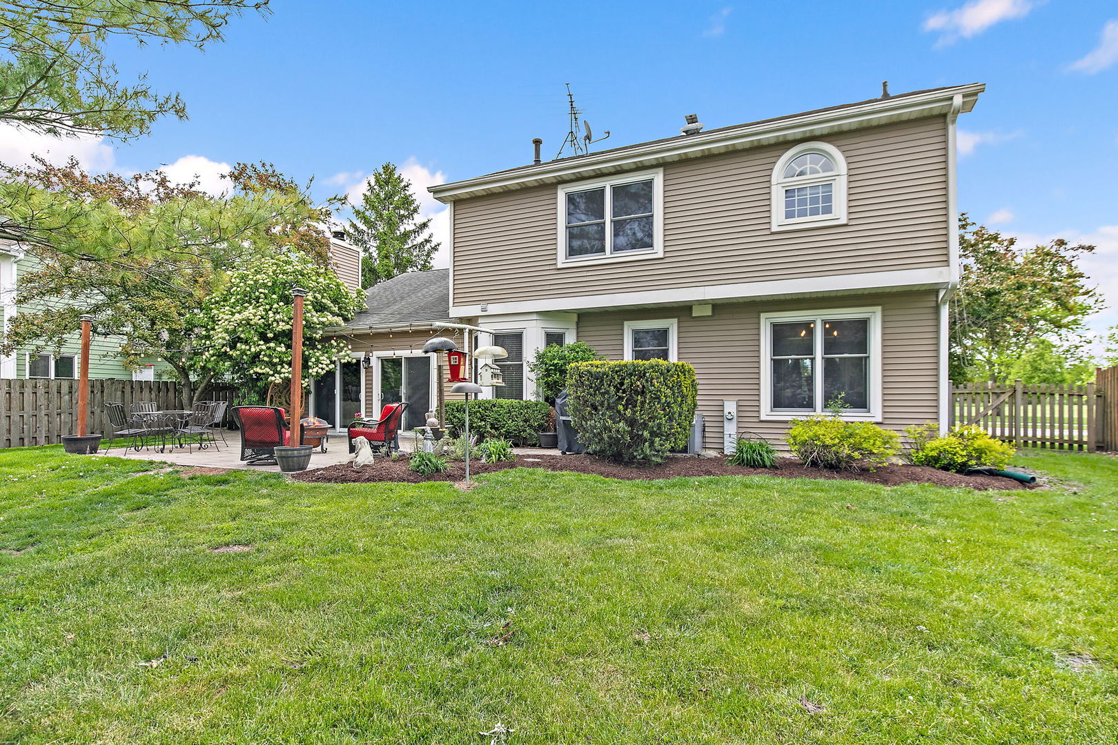 112 Thompson Boulevard Buffalo Grove, IL 60089 - Photo 32 of 34 a front view of house with yard and outdoor seating