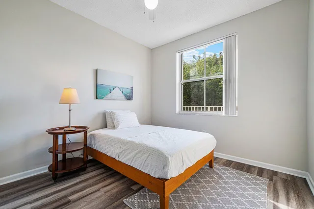 a bedroom with a bed and window