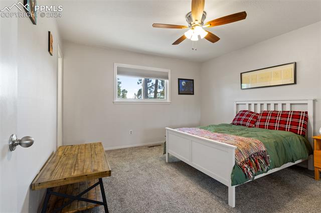 8135 Swan Road Colorado Springs, CO 80908 - Photo 10 of 16 Carpeted bedroom featuring ceiling fan