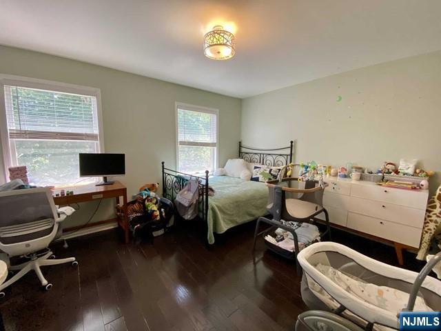 144 Panorama Drive Edgewater, NJ 07020 - Photo 4 of 10 a bedroom with bed or couch and a flat screen tv
