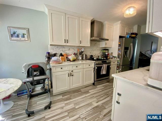 144 Panorama Drive Edgewater, NJ 07020 - Photo 6 of 10 a kitchen with a sink cabinets and wooden floor