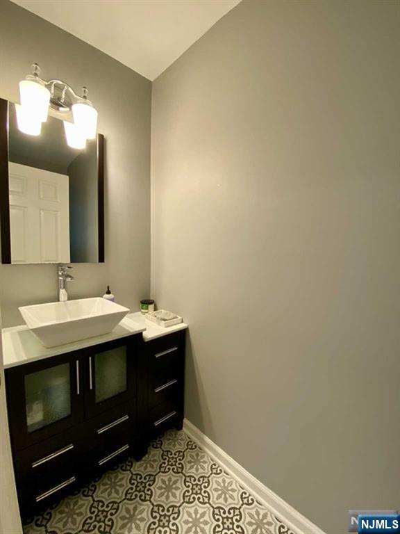 144 Panorama Drive Edgewater, NJ 07020 - Photo 8 of 10 a bathroom with a sink and a mirror