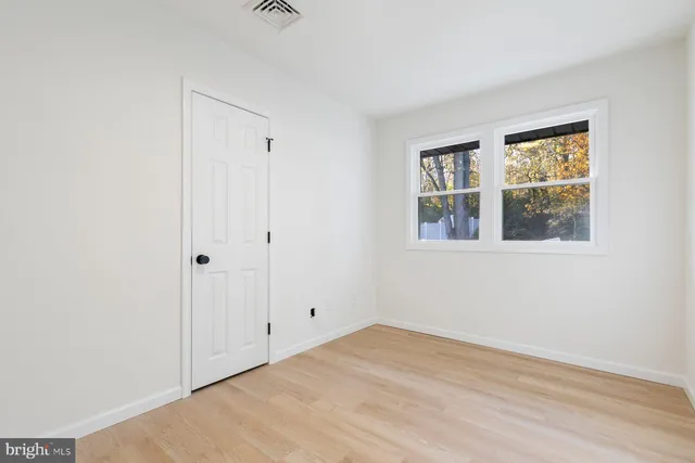 a view of empty room with windows