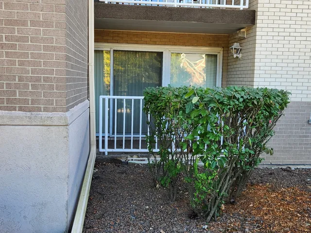 a view of a house with a small yard