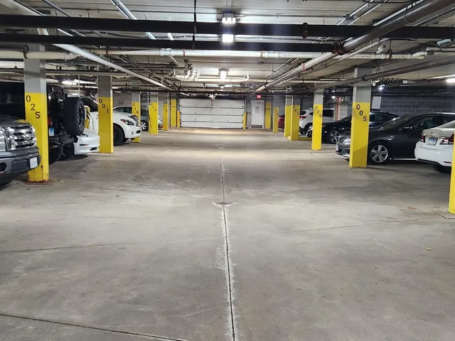 a view of a garage with wooden floors