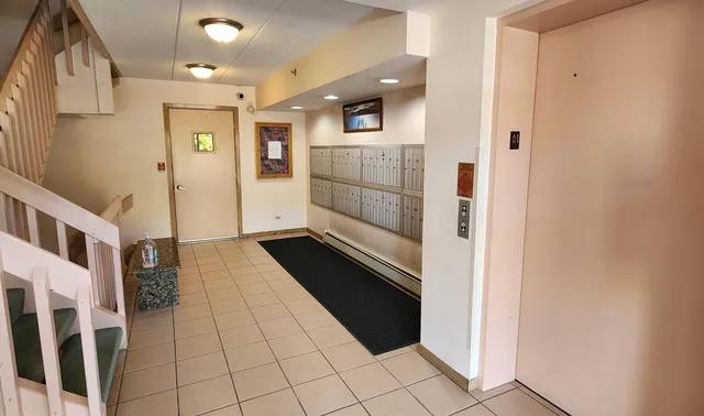 a view of a refrigerator and an empty room