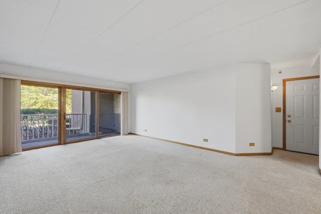a view of an empty room with a balcony
