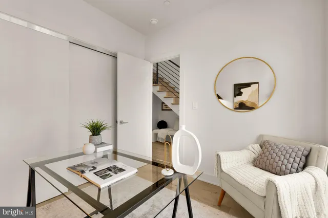 a bedroom with a bed and a a mirror