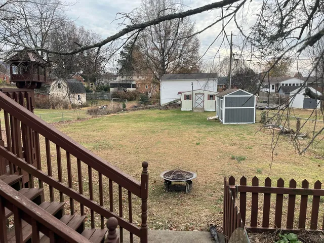 a view of residential house with wooden fence