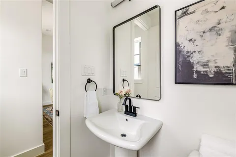 a bathroom with a sink and mirror