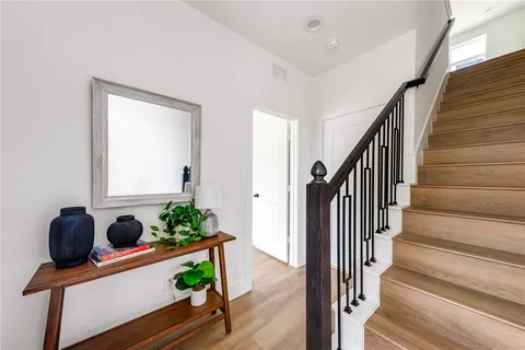 a dining room with table and stairs