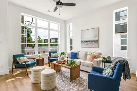a living room with furniture and a large window